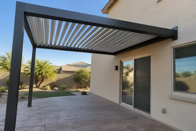 Adjustable louvered roof on a cantilever shade structure over a stamped concrete patio in Gilbert, AZ.