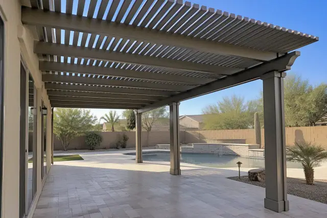Alumawood pergola installation with lattice rafters over a travertine patio in a Gilbert, AZ backyard.