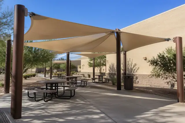 Contractor photo of a tensioned shade membrane at a public seating pavilion in Gilbert, AZ.