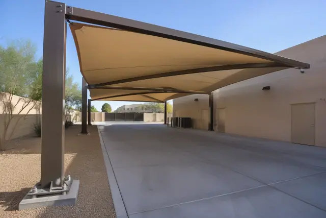Heavy-duty anchor bolts secured in a concrete base for a cantilever shade structure at a home in Chandler, AZ.