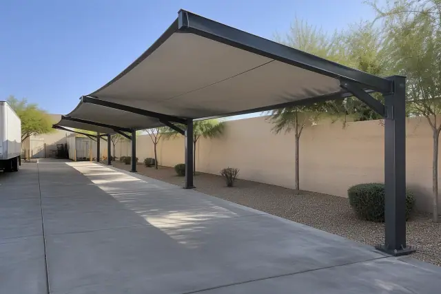 Cantilever shade structures over a concrete loading zone at an outdoor commercial property in Tempe, AZ.