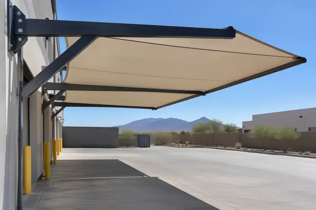 Cantilever shade structure with heavy-duty tension bolts on a concrete loading zone in Phoenix, AZ.