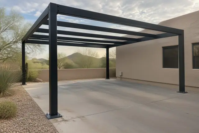 Metal carport skeleton anchored to a concrete parking slab in Fountain Hills, AZ.