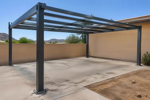 Metal carport structural skeleton installed over a parking slab in Queen Creek, AZ.