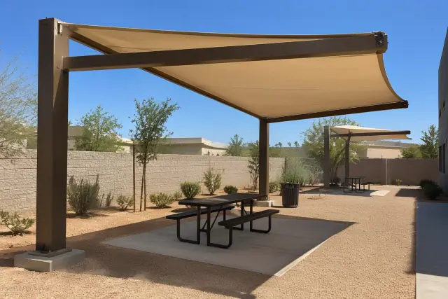 Cantilever shade structures in a commercial courtyard with decomposed granite in Gilbert, AZ.