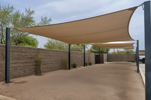 Shade sail installation over a commercial parking area in Gilbert, AZ.