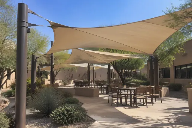Commercial shade structures over an outdoor pavilion and walkway in Mesa, AZ.