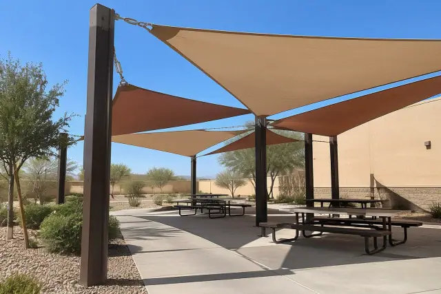 Multi-post tensioned membrane shade structure over an outdoor seating pavilion in San Tan Valley, AZ.