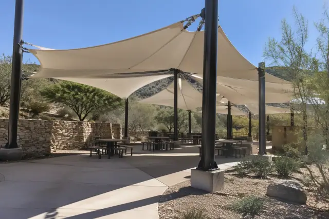 Tensioned membrane shade structure over a public seating pavilion in Scottsdale, AZ.