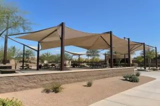 Multi-post tensioned membrane shade array over a public pavilion in Gilbert, AZ.