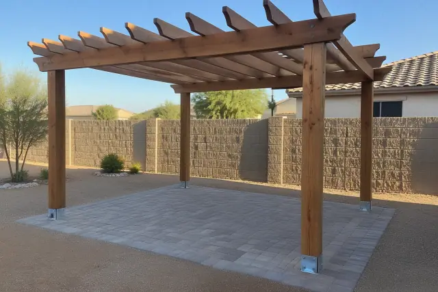 Custom wood pergola with galvanized brackets over patio pavers in a residential backyard in Gilbert, AZ.