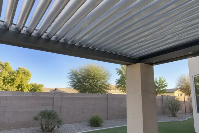 Fixed louvered pergola installation in a Gilbert, AZ backyard with extruded aluminum louvers.