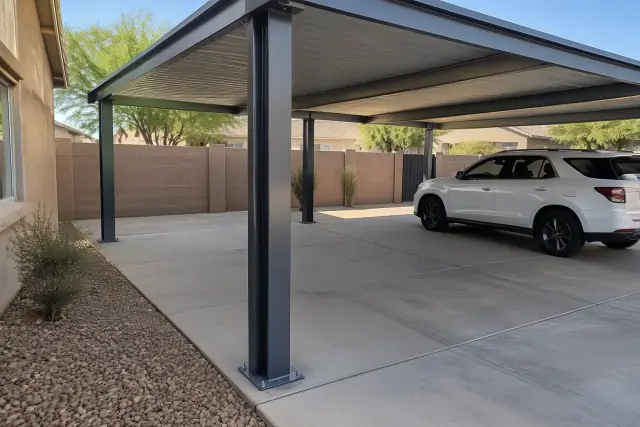 Newly installed freestanding carport steel column baseplate on concrete in Gilbert, AZ.