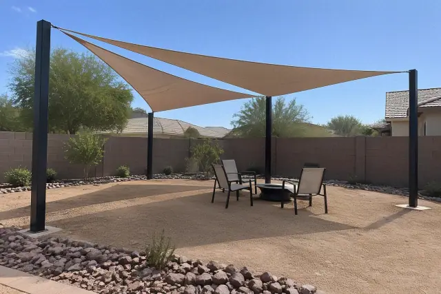 Freestanding post-supported shade sails installed over a landscape in Gilbert, AZ.