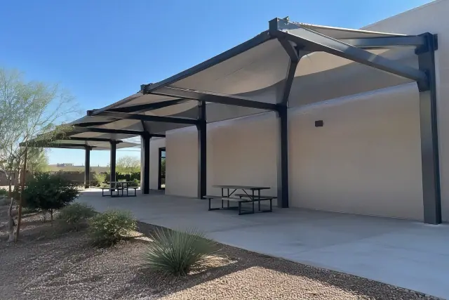 Industrial and hybrid canopies with structural steel columns at a commercial job site in Gilbert, AZ.