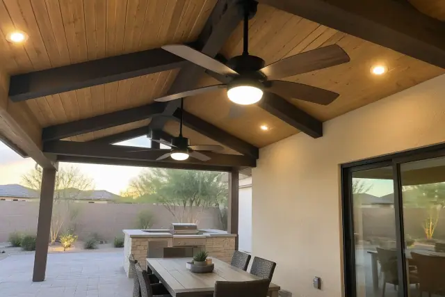 Newly installed outdoor ceiling fan and lighting on a timber beam in a Gilbert, AZ backyard.