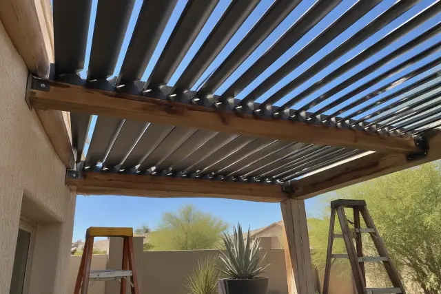 Active louvered roof installation on a stone patio in Queen Creek, AZ.