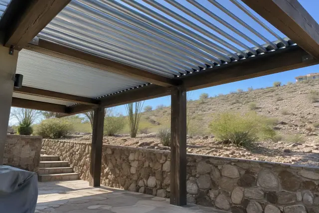 Louvered roof installation on a timber beam patio in Fountain Hills, AZ, with an arid hillside backdrop.