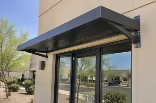 Extruded aluminum canopy mounted over a storefront in Gilbert, AZ.