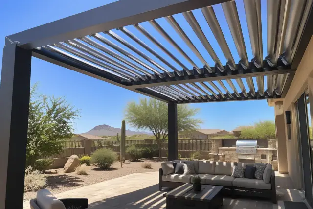 Motorized adjustable roof with open aluminum louvers over a desert-stone patio in Gilbert, AZ.