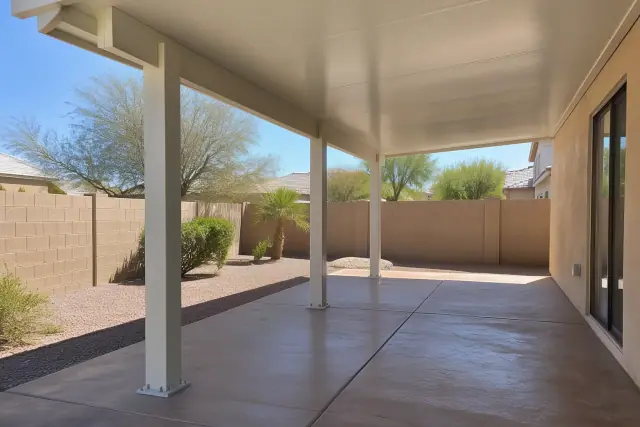 Solid insulated patio cover roof panel assembled on aluminum posts in Gilbert, AZ.