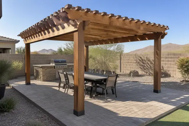 Freestanding wood rafter pergola installed over a backyard paver deck in Queen Creek, AZ.