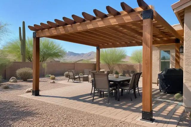 Freestanding wood rafter pergola over a backyard paver deck in Apache Junction, AZ.