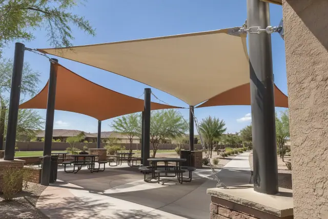 Tensioned fabric membrane secured with turnbuckles on an outdoor pavilion in Gilbert, AZ.