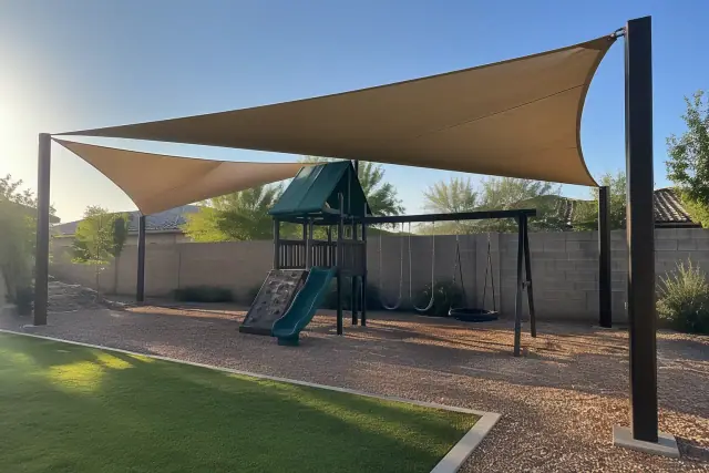 Playground and cantilever shade structures installed in a residential backyard in Gilbert, AZ.