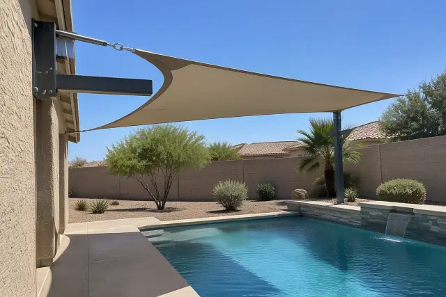 Pool deck shade structure with steel brackets and tension cables at a home in Gilbert, AZ.