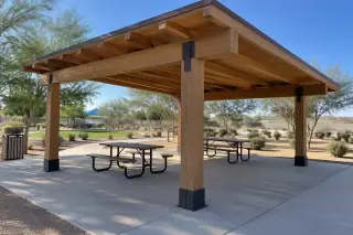 Heavy timber post and beam pavilion frame over a concrete slab in Gilbert, AZ.