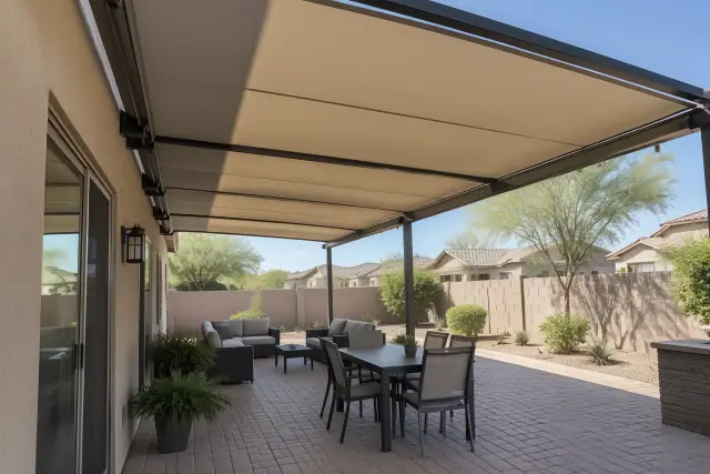 Retractable patio covers installed over a desert-stone paver patio in Gilbert, AZ.