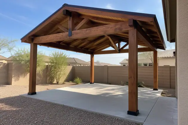 Semi-open timber ramada construction over a concrete slab in a backyard in Gilbert, AZ.
