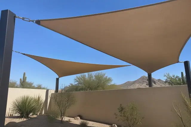Contractor photo of a shade sail installation over desert gravel in Scottsdale, AZ.