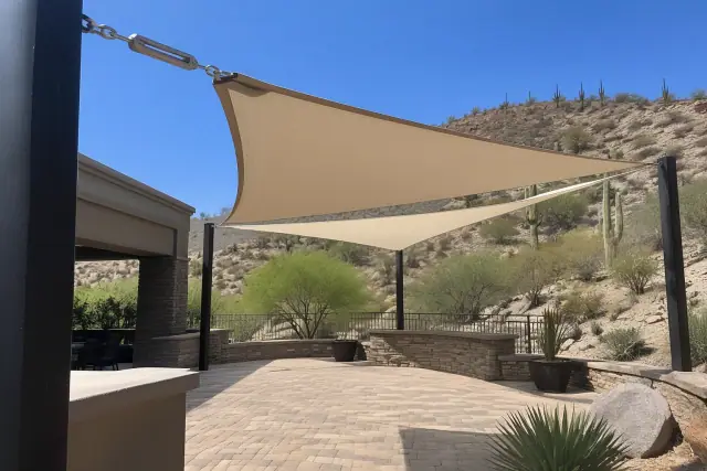 Shade sail installation over a desert stone paver courtyard in Fountain Hills, AZ.