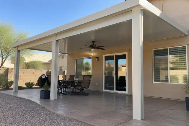 Solid aluminum and insulated patio cover installation at a Gilbert, AZ backyard.