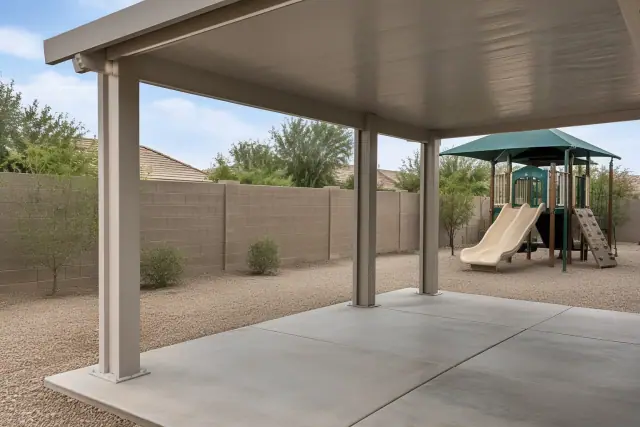 Solid-roof ramada and patio cover with an aluminum support column in Gilbert, AZ.