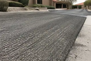 Parallel milling grooves and coarse aggregate on a finished asphalt surface in Goodyear, AZ.