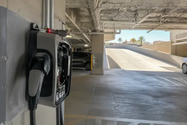 Hand tool on an EV charger housing during troubleshooting in Mesa, AZ.