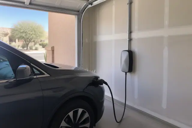EV charger replacement and upgrades on a garage wall in Mesa, AZ.