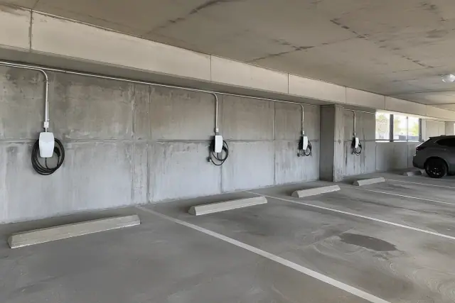 Tesla Wall Connector installation in Mesa, AZ, showing contractor progress in a parking garage.
