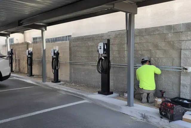 EV charger installation with pedestal charging ports and conduit at an apartment in Scottsdale, AZ.