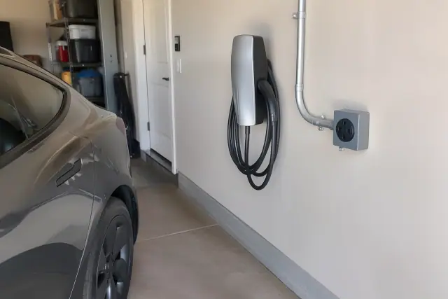 NEMA 14-50 EV charger outlet installation on a garage wall in Tempe, AZ.