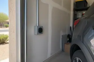 NEMA 14-50 outlet installation with clean finished details on a drywalled garage wall in Mesa, AZ.