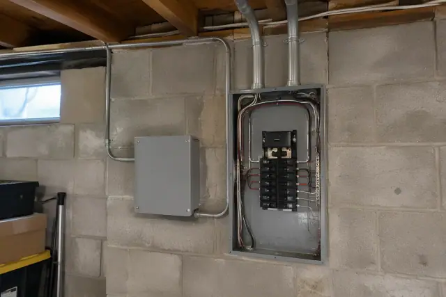 EV charger subpanel mounted on a basement wall in Mesa, AZ.
