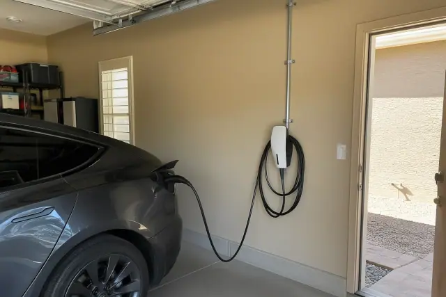Tesla Wall Connector installation in a residential garage in Tempe, AZ.