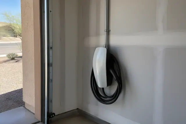 Tesla Wall Connector installation on a drywalled interior wall in Queen Creek, AZ.
