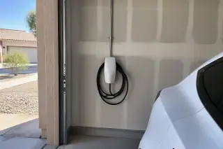 Tesla Wall Connector installation on a drywalled interior garage wall in Mesa, AZ.