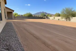 Wide view of finished site preparation and grading at a residential property in Mesa, AZ.