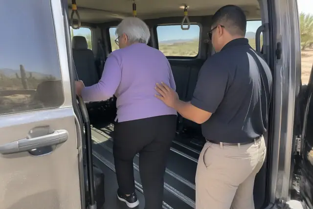 Interior of medical transport vehicle with floor tracks and grab handles in Mesa, AZ.